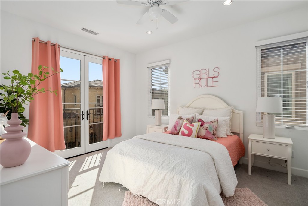 57 Bandana Irvine, CA 92602 - Photo 20 of 32 a bedroom with a bed and a large window