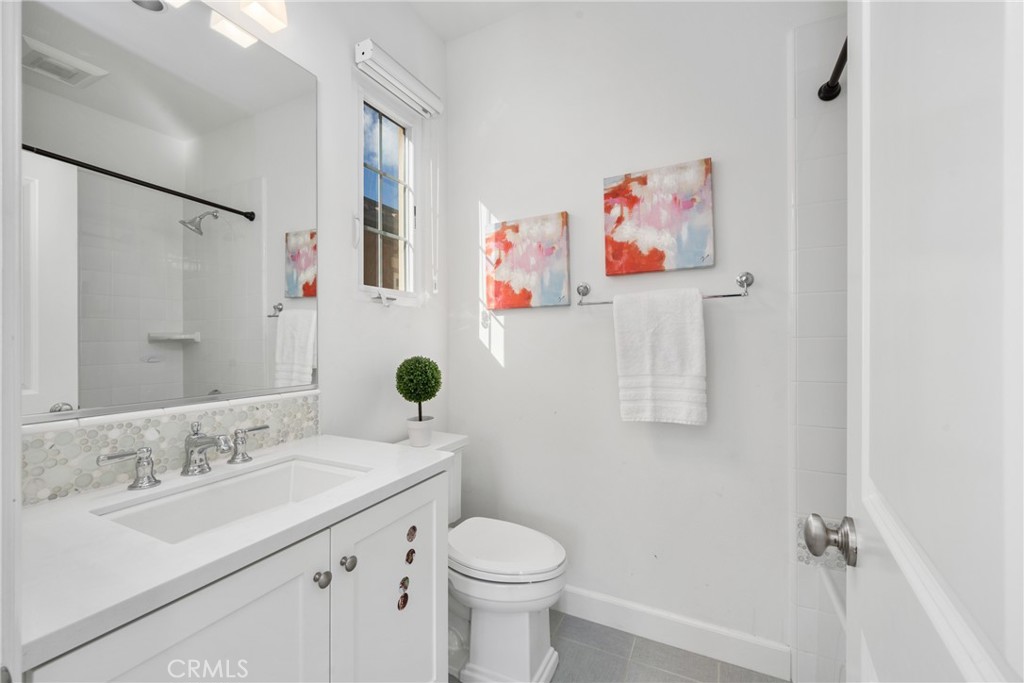 57 Bandana Irvine, CA 92602 - Photo 21 of 32 a bathroom with a sink mirror vanity and toilet