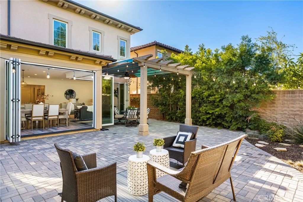 57 Bandana Irvine, CA 92602 - Photo 23 of 32 a view of a patio with couches table and chairs and potted plants