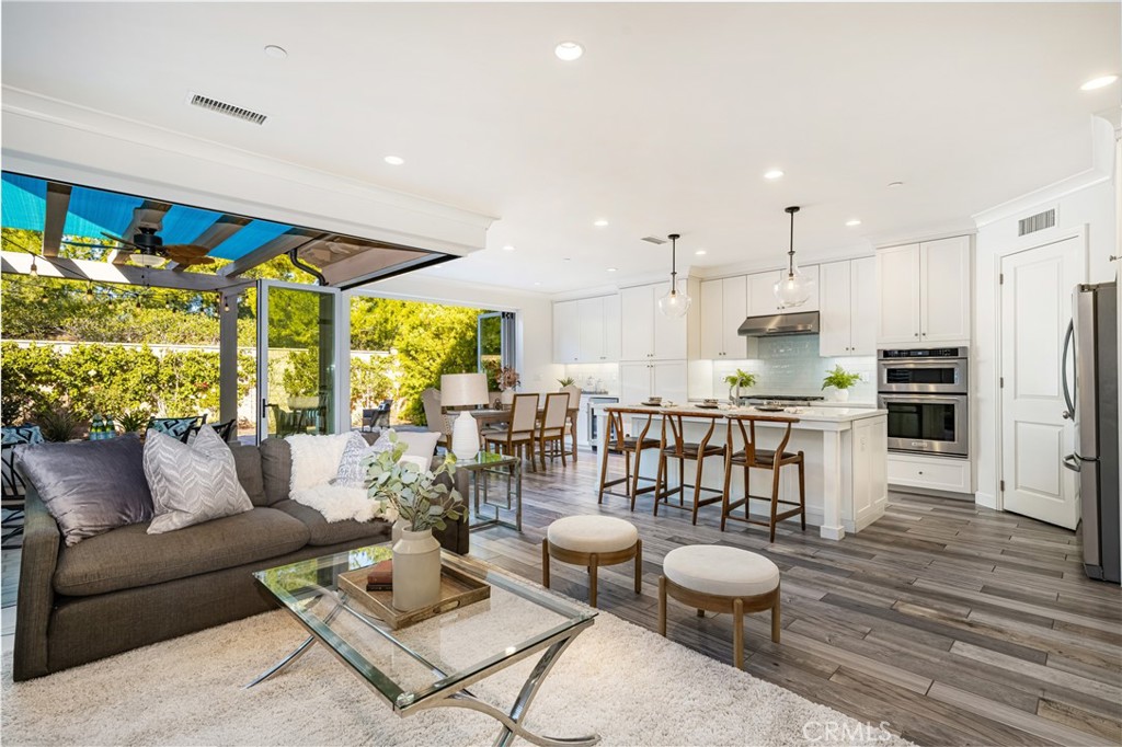 57 Bandana Irvine, CA 92602 - Photo 4 of 32 a living room with furniture and kitchen view