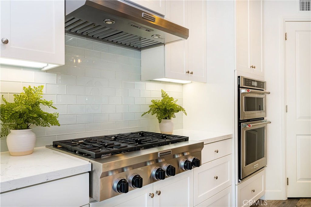 57 Bandana Irvine, CA 92602 - Photo 8 of 32 a white stove top oven sitting inside of a kitchen