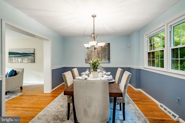 a kitchen with stainless steel appliances granite countertop a stove refrigerator and a microwave