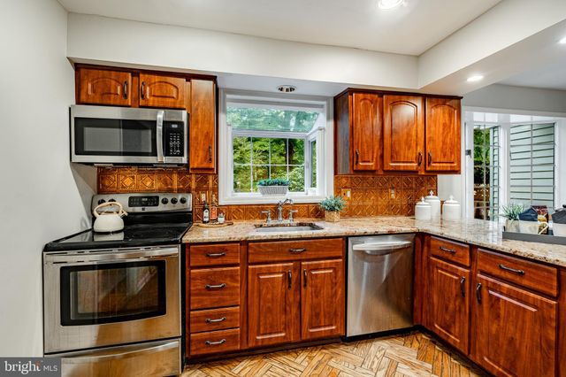 a white refrigerator freezer sitting in a kitchen