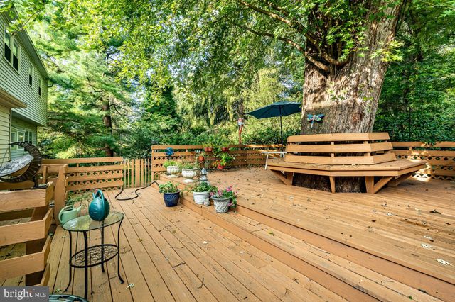 a view of a grassy field with trees