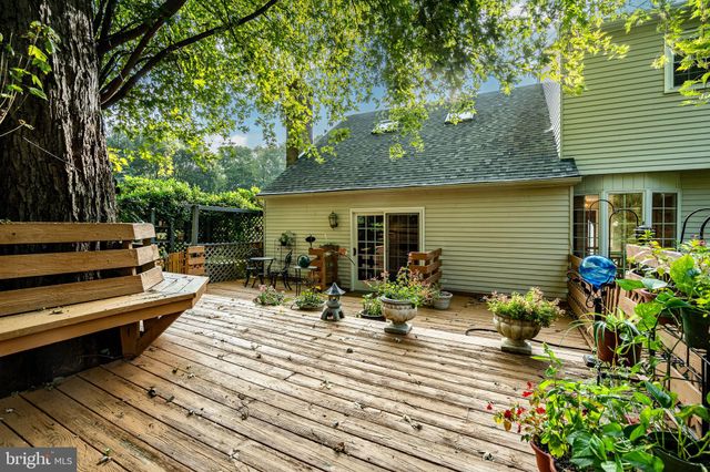 a view of green field with trees in the background