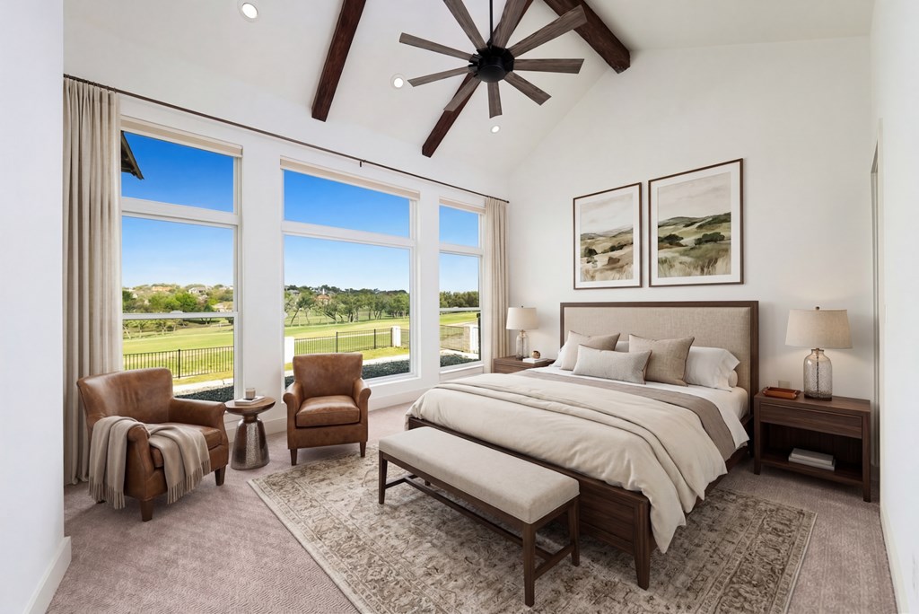 1029 Club House Road Kerrville, TX 78028 - Photo 21 of 62 a bedroom with a bed a couch and a large window