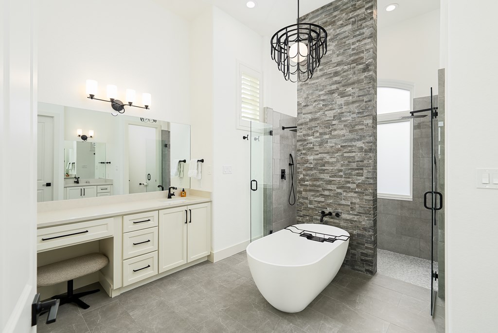 1029 Club House Road Kerrville, TX 78028 - Photo 25 of 62 a spacious bathroom with a shower a mirror and a sink