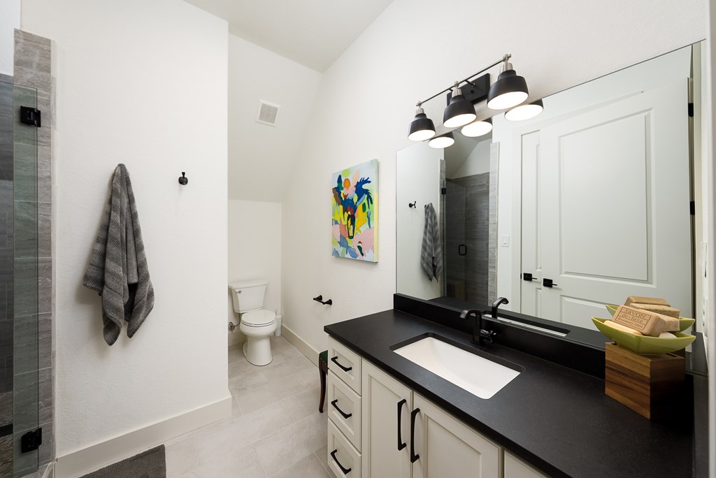 1029 Club House Road Kerrville, TX 78028 - Photo 45 of 62 a room with a sink and a mirror