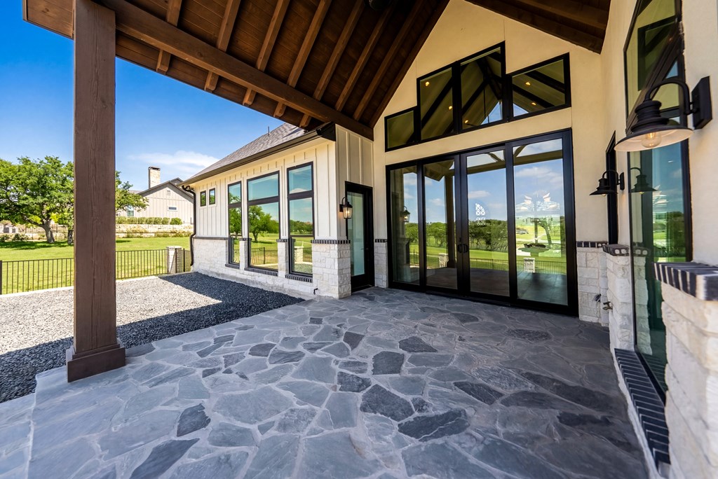 1029 Club House Road Kerrville, TX 78028 - Photo 49 of 62 a view of a porch with a floor to ceiling window