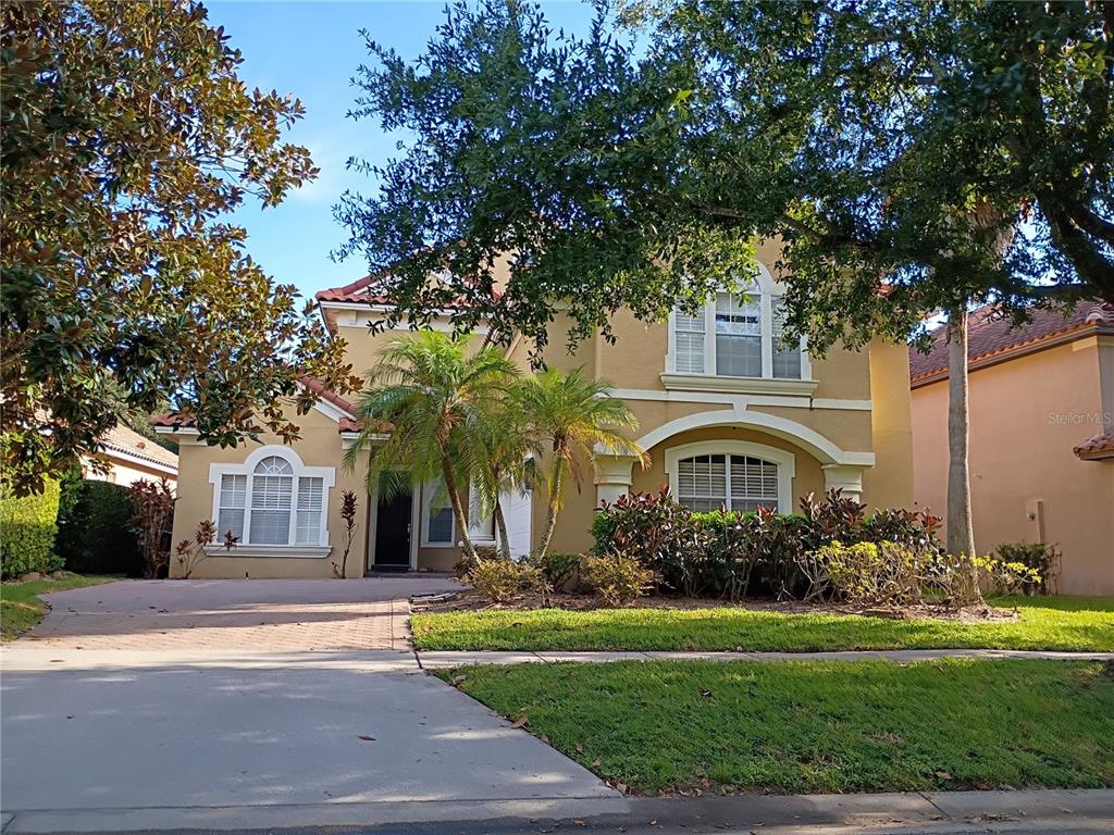 1626 Whitney Isles Drive Windermere, FL 34786 - Photo 1 of 8 a front view of a house with garden