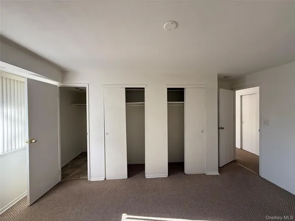 a view of empty room with windows
