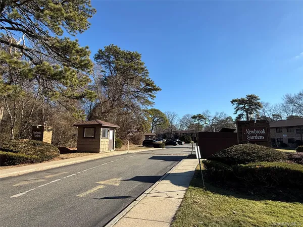 a view of a street with houses on both side