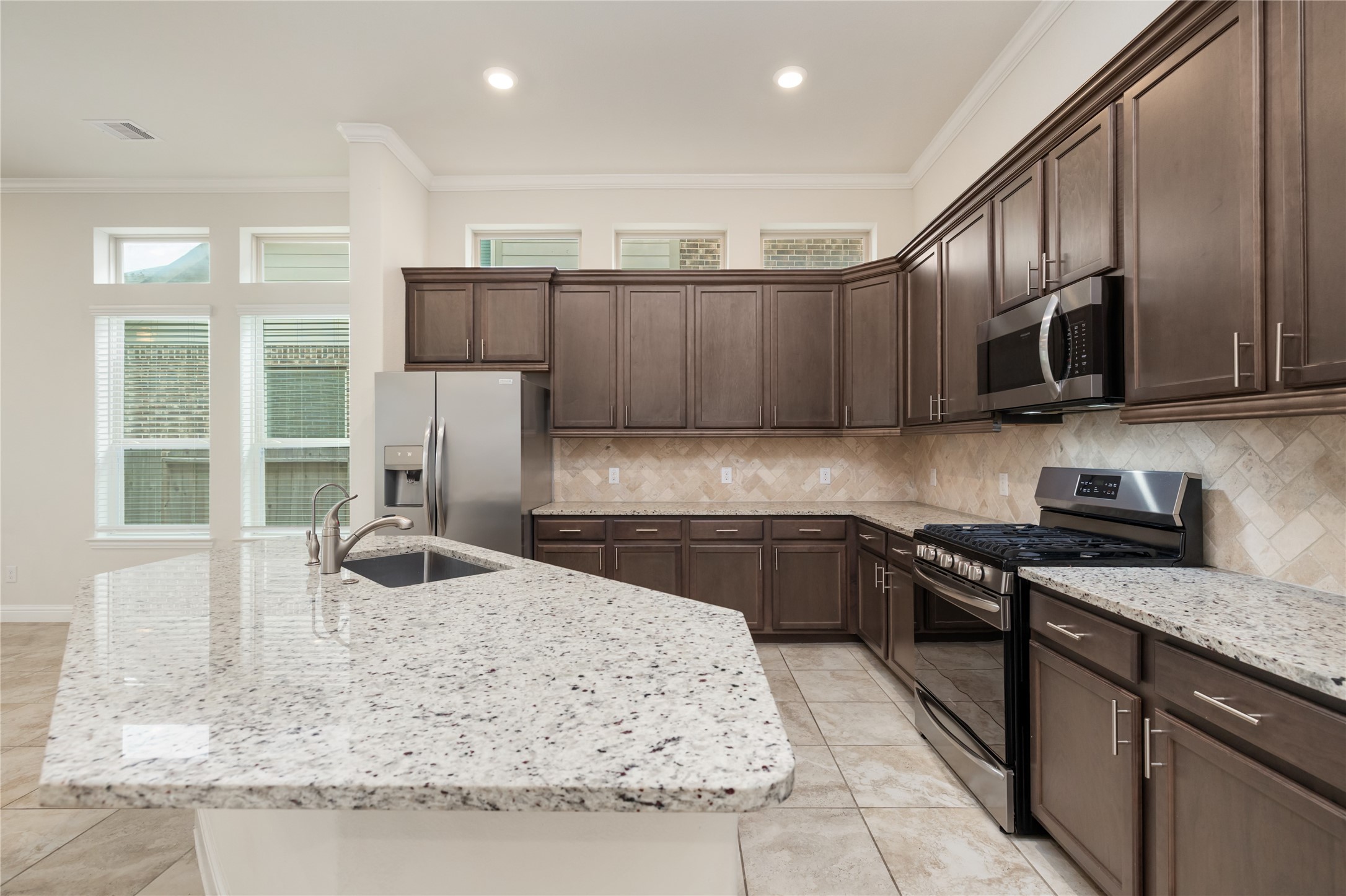 Large kitchen featuring plenty of cabinets and gorgeous granite countertops
Refrigerator included