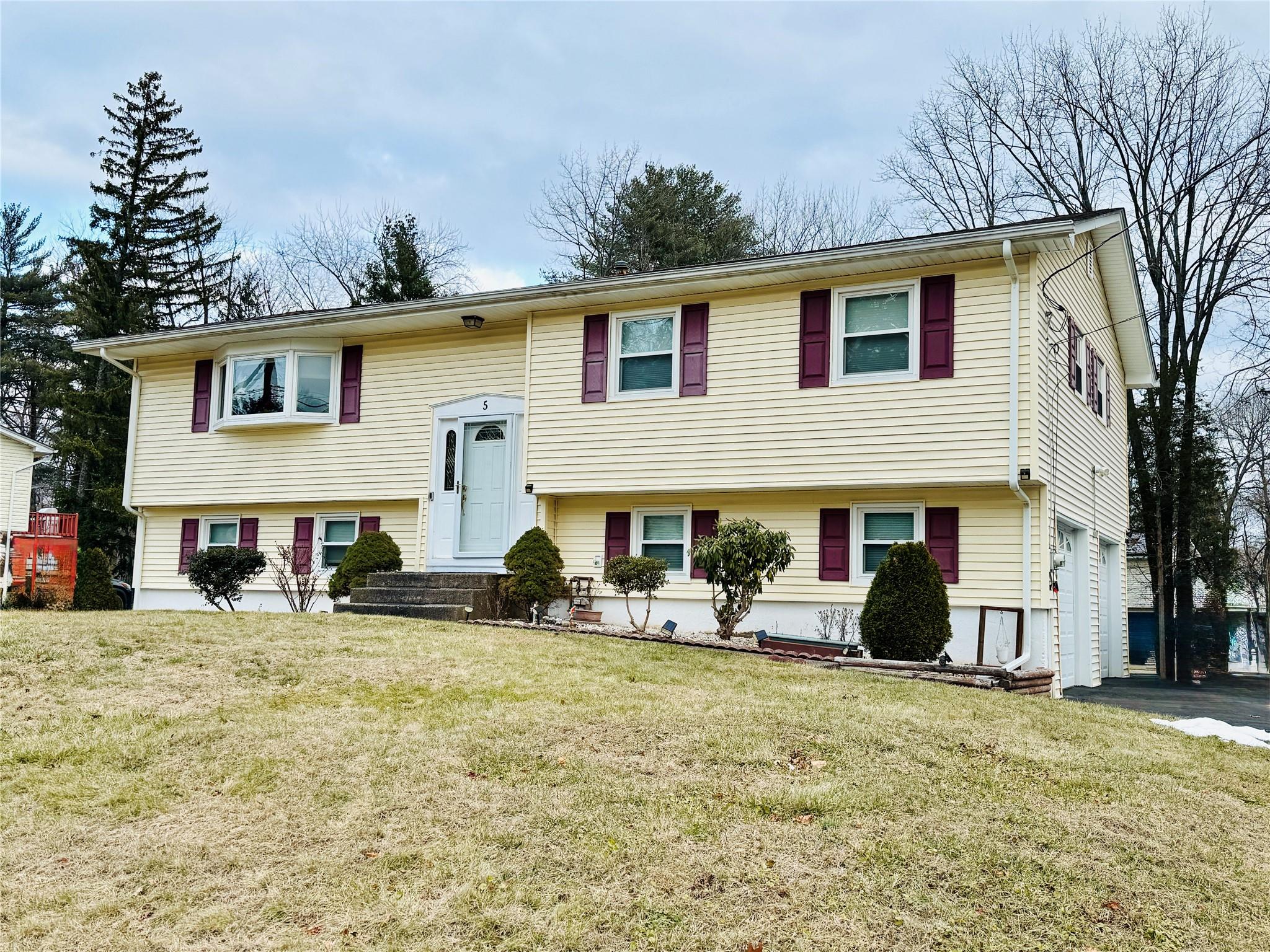 5 Inland Road New City, NY 10956 - Photo 1 of 1 Raised ranch with a front yard and a garage