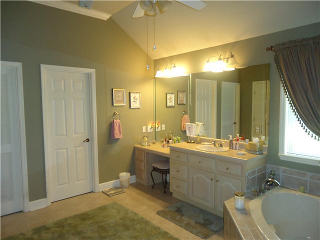 30724 Mill Race Road Ardmore, TN 38449 - Photo 12 of 20 Master Bath - Featuring tile flooring, make-up counter and garden tub with tile surround.