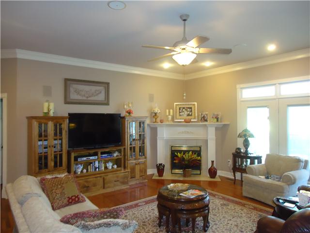 30724 Mill Race Road Ardmore, TN 38449 - Photo 5 of 20 Living Room - Featuring surround sound, wood flooring, recessed lighting, crown molding and a gas log fireplace.