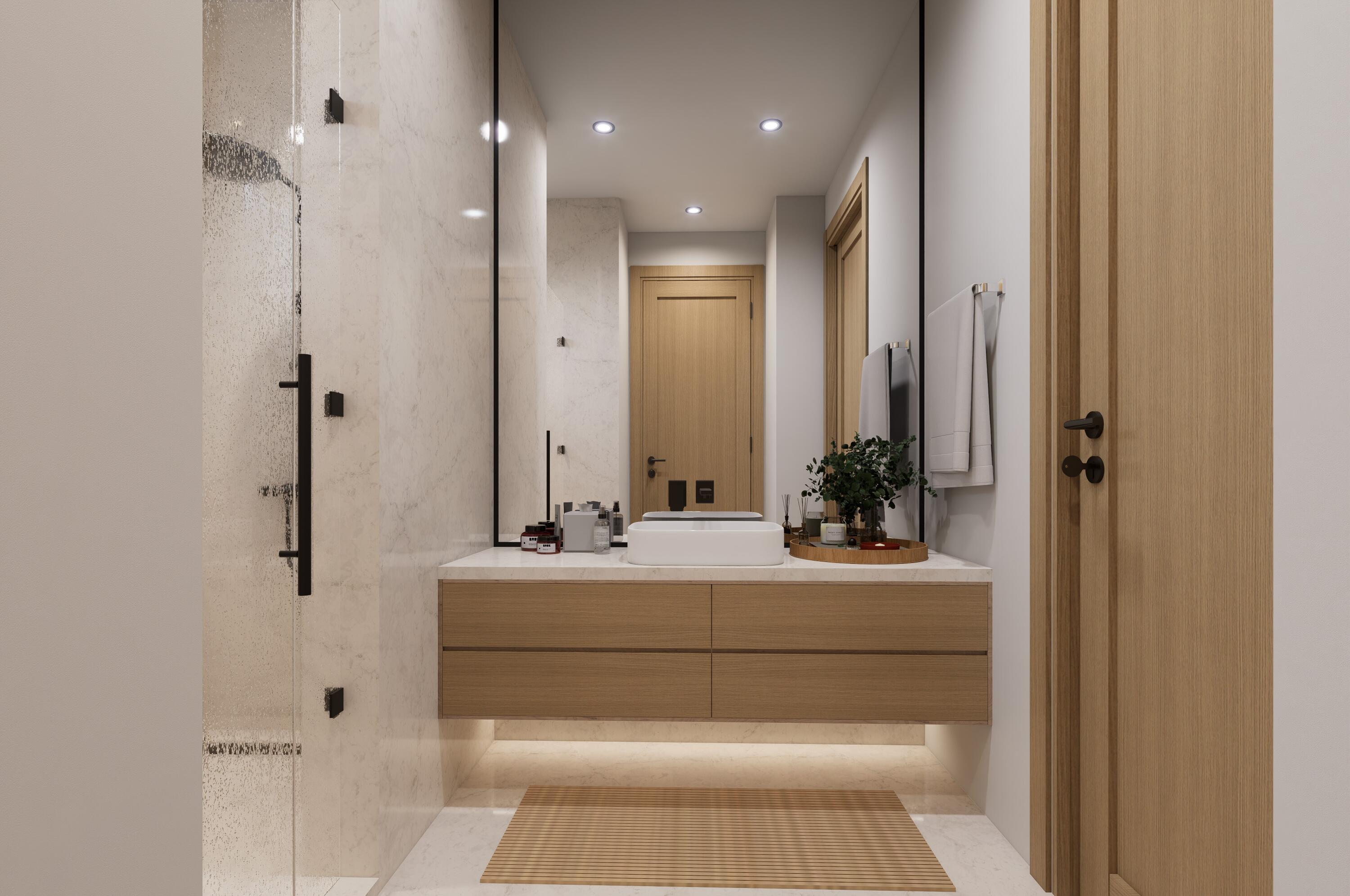 1160 Emerald Lane Singer Island, FL 33404 - Photo 36 of 37 a en suite bathroom with a sink and mirror