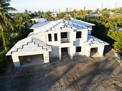 1160 Emerald Lane Singer Island, FL 33404 - Photo 5 of 37 a view of a white house with a yard plants and large tree