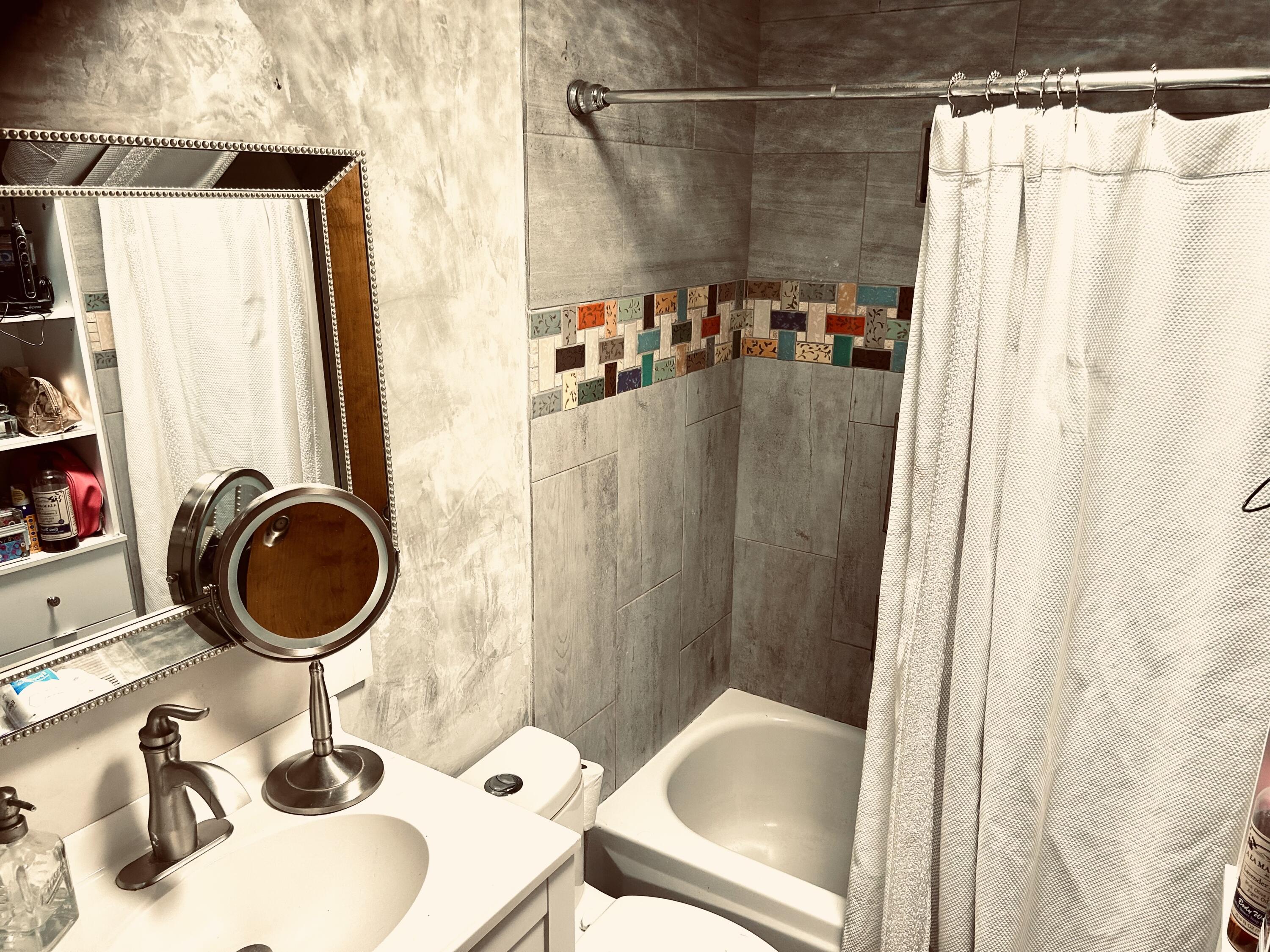 68964 Graham Court Sisters, OR 97759 - Photo 16 of 28 a bathroom with a sink toilet and shower