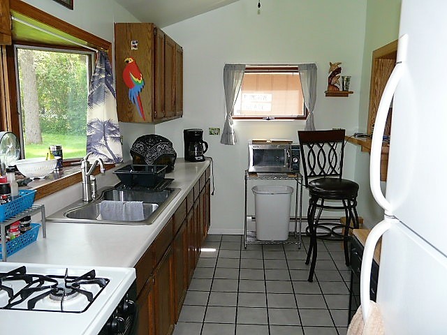 26325 West Central Road Ingleside, IL 60041 - Photo 11 of 18 a kitchen with a sink cabinets and window