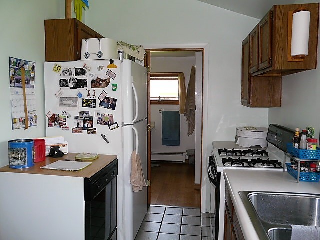 26325 West Central Road Ingleside, IL 60041 - Photo 9 of 18 a kitchen with stainless steel appliances a refrigerator and a stove top oven