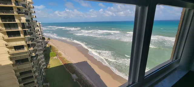 a view of balcony with wooden floor