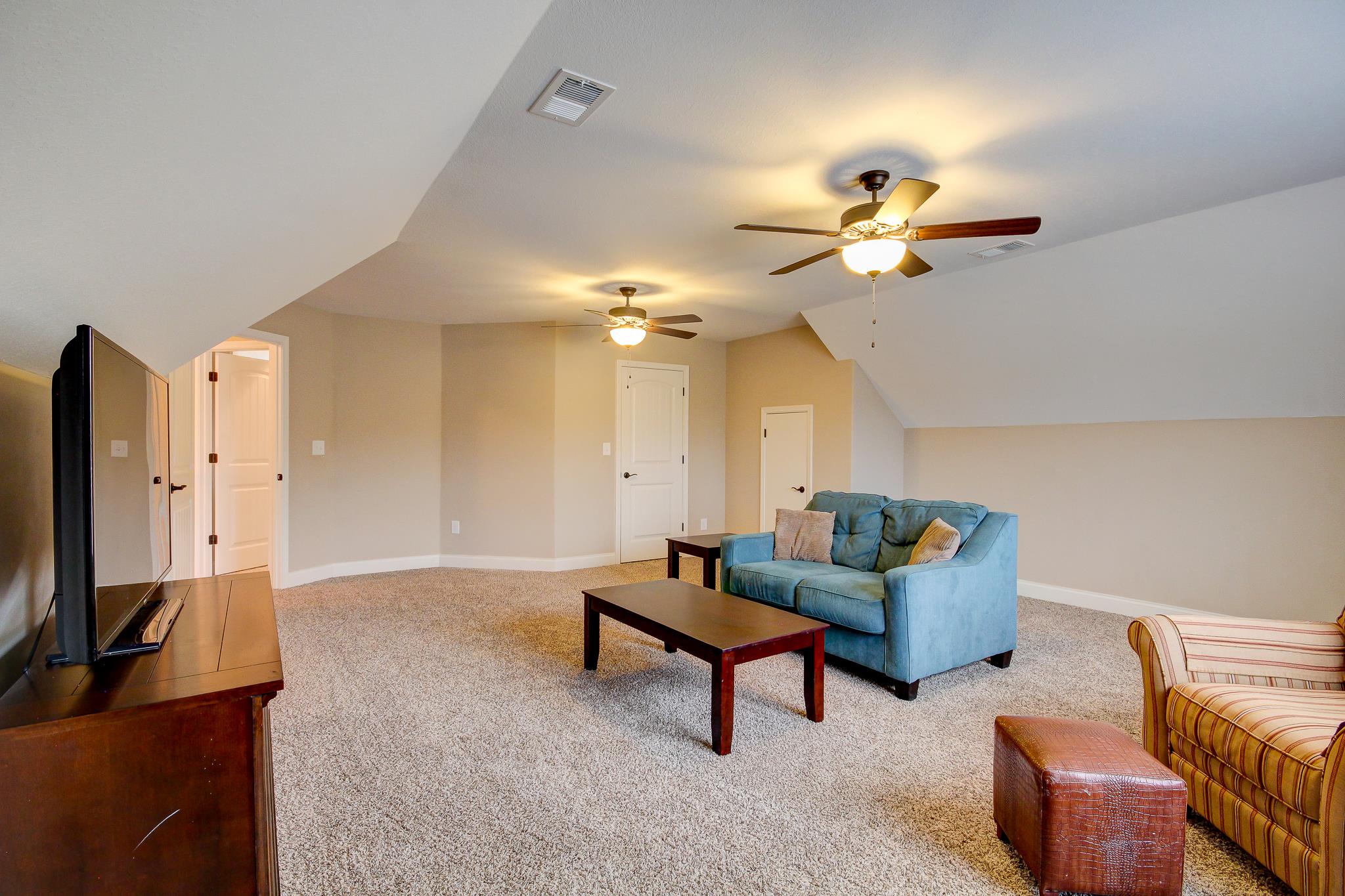 1012 Barnhill Road Clarksville, TN 37043 - Photo 14 of 18 a living room with furniture a dining table and a flat screen tv