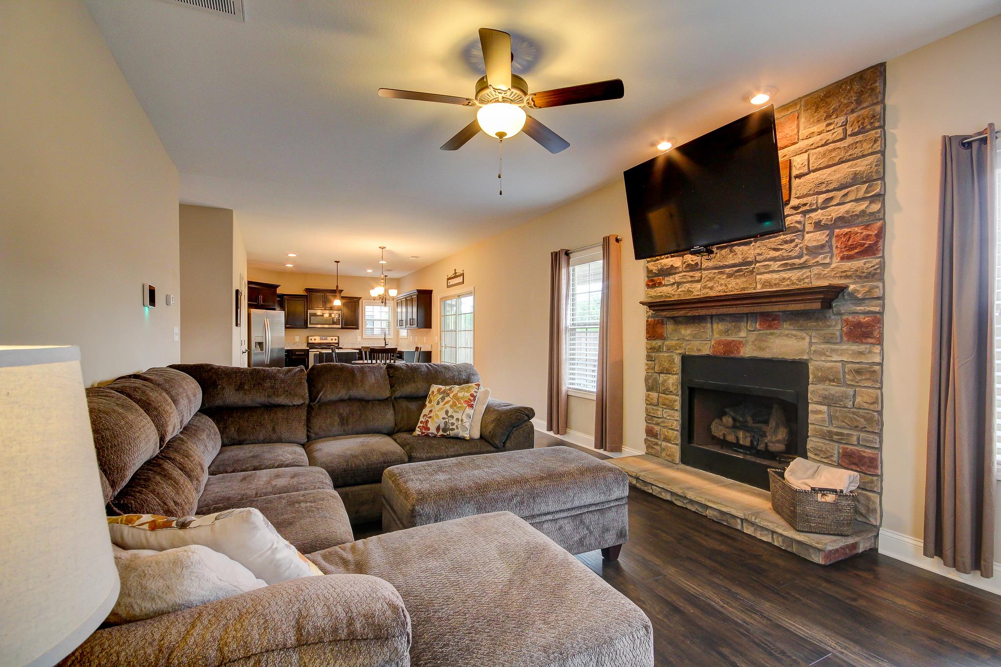 1012 Barnhill Road Clarksville, TN 37043 - Photo 6 of 18 a living room with furniture a fireplace and a flat screen tv