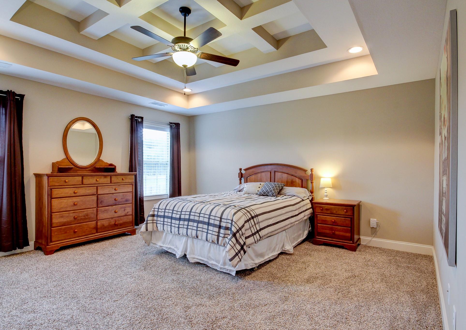1012 Barnhill Road Clarksville, TN 37043 - Photo 7 of 18 a bedroom with a bed and a chandelier