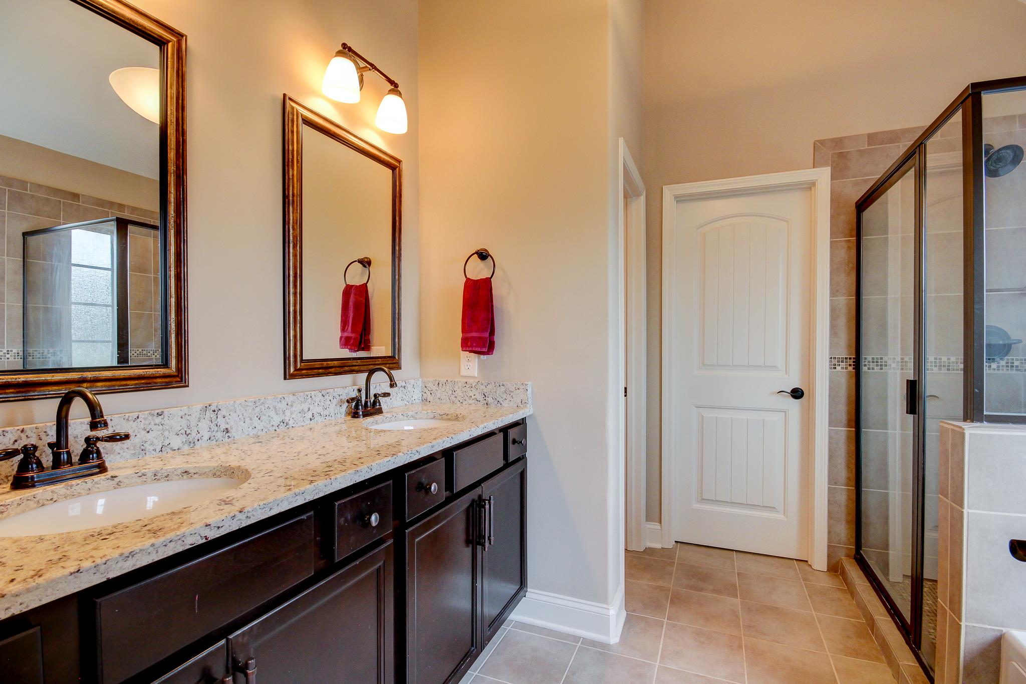 1012 Barnhill Road Clarksville, TN 37043 - Photo 9 of 18 a bathroom with a granite countertop sink and a mirror