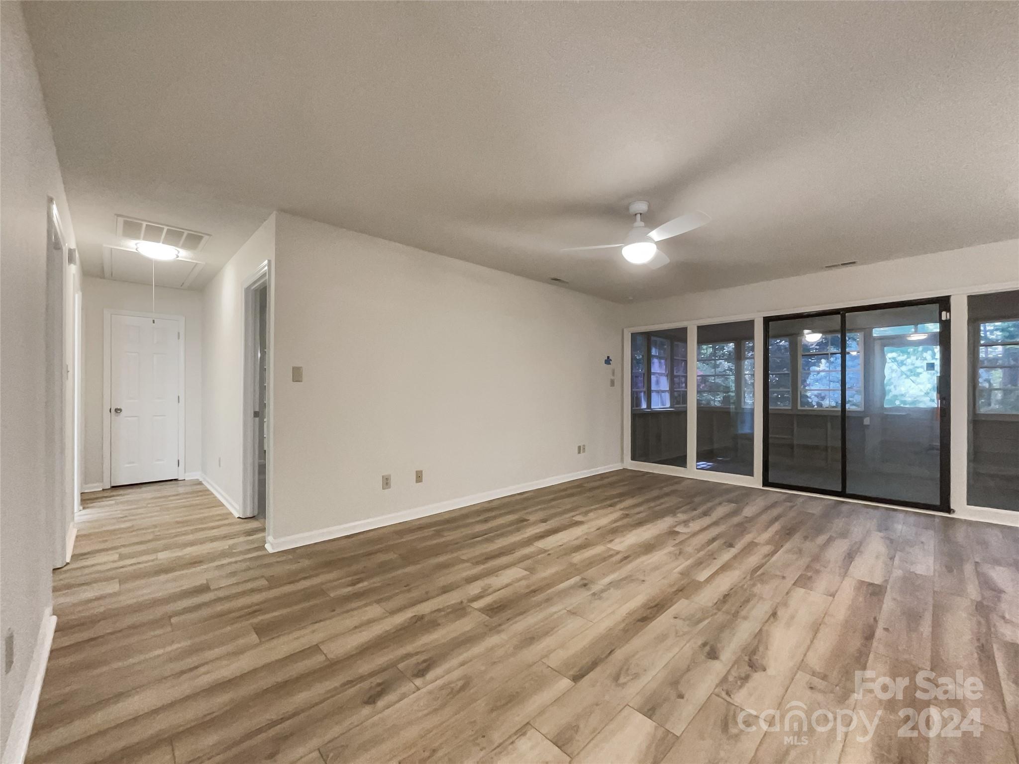 123 David Court Fort Mill, SC 29715 - Photo 11 of 18 a view of an empty room with wooden floor and a window