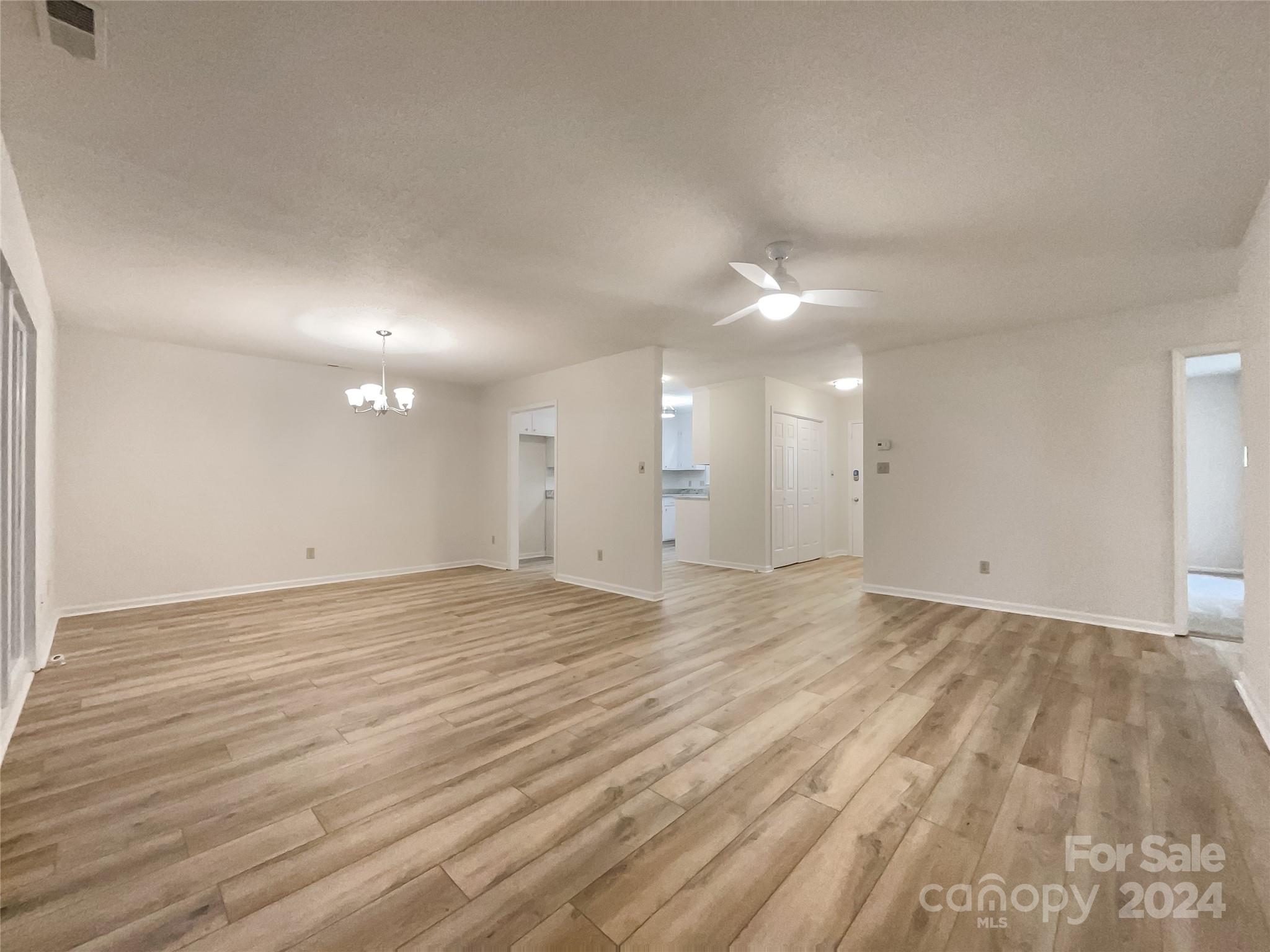 123 David Court Fort Mill, SC 29715 - Photo 3 of 18 a view of an empty room with wooden floor and a window