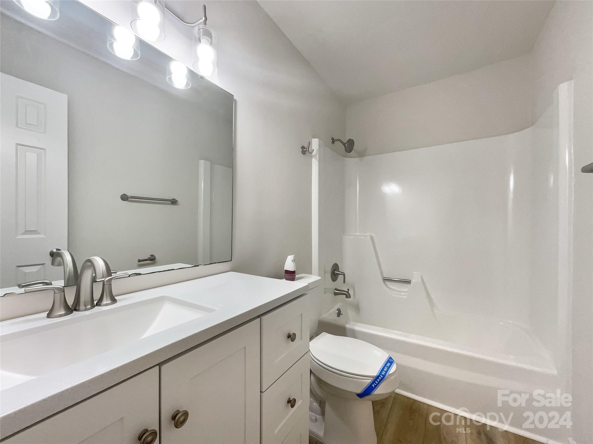 123 David Court Fort Mill, SC 29715 - Photo 7 of 18 a bathroom with a sink a toilet a mirror and shower