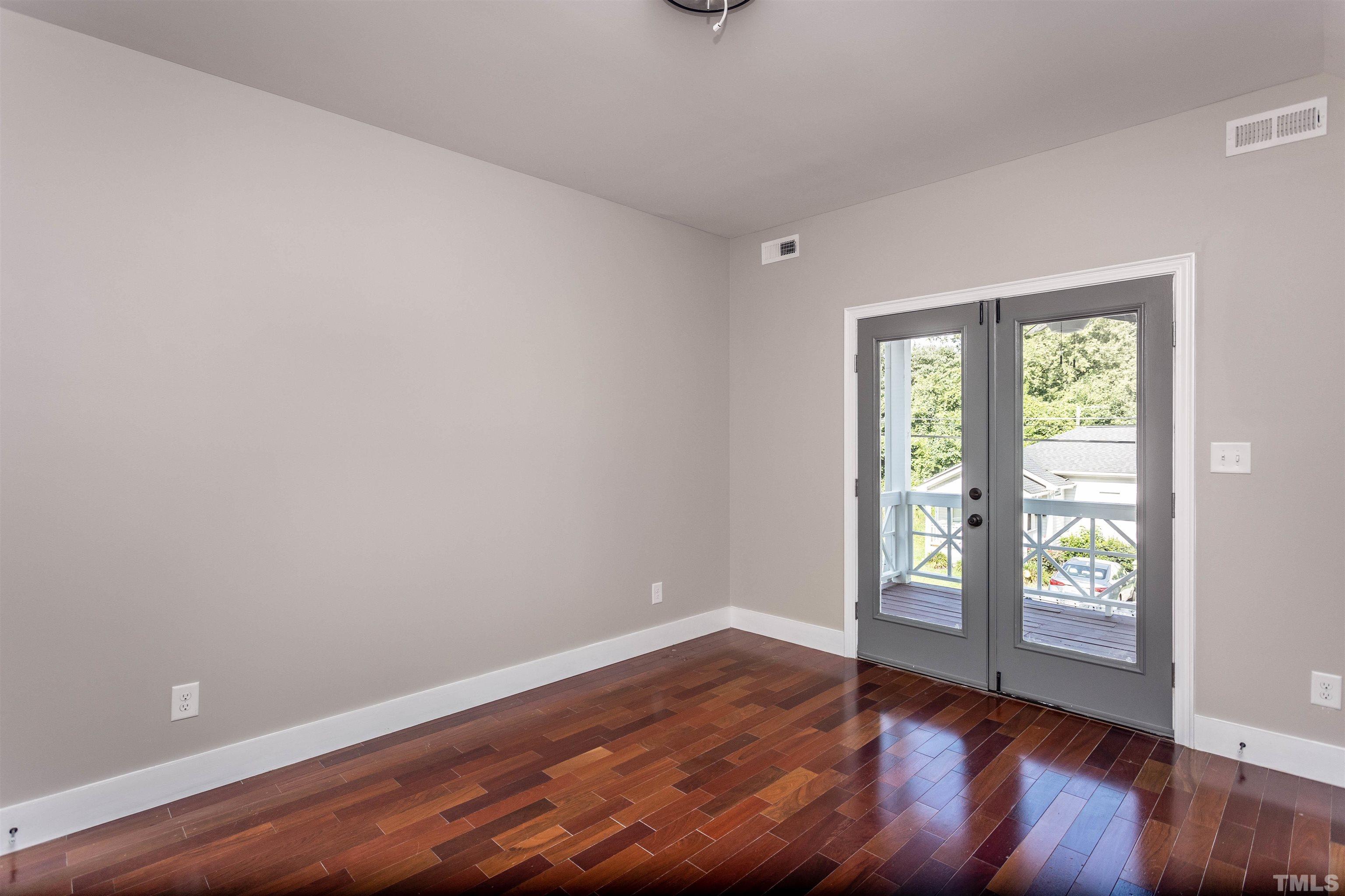312 Freeman Street Raleigh, NC 27601 - Photo 15 of 30 wooden floor in an empty room with a window