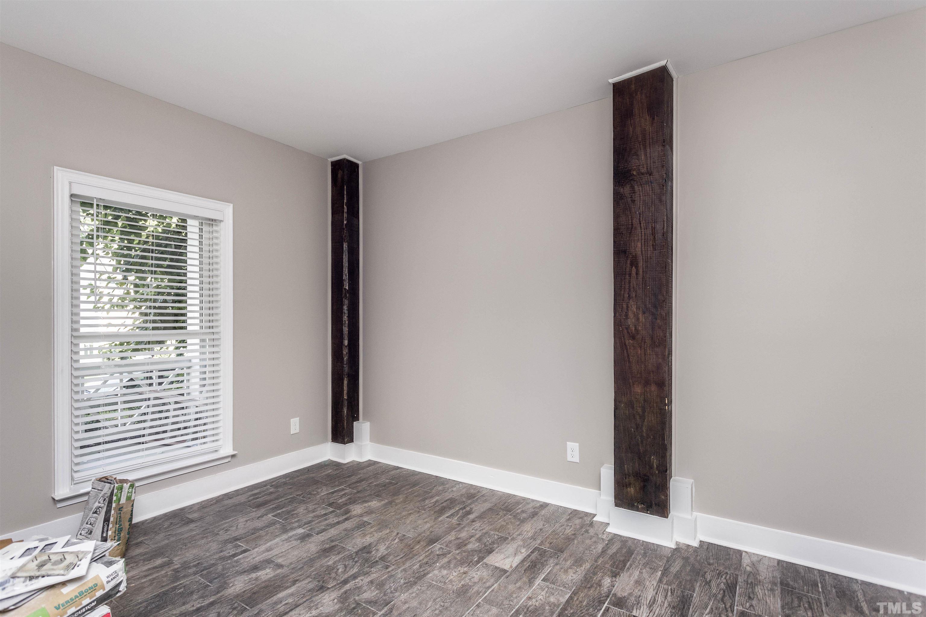 312 Freeman Street Raleigh, NC 27601 - Photo 19 of 30 a view of an empty room with wooden floor and a window
