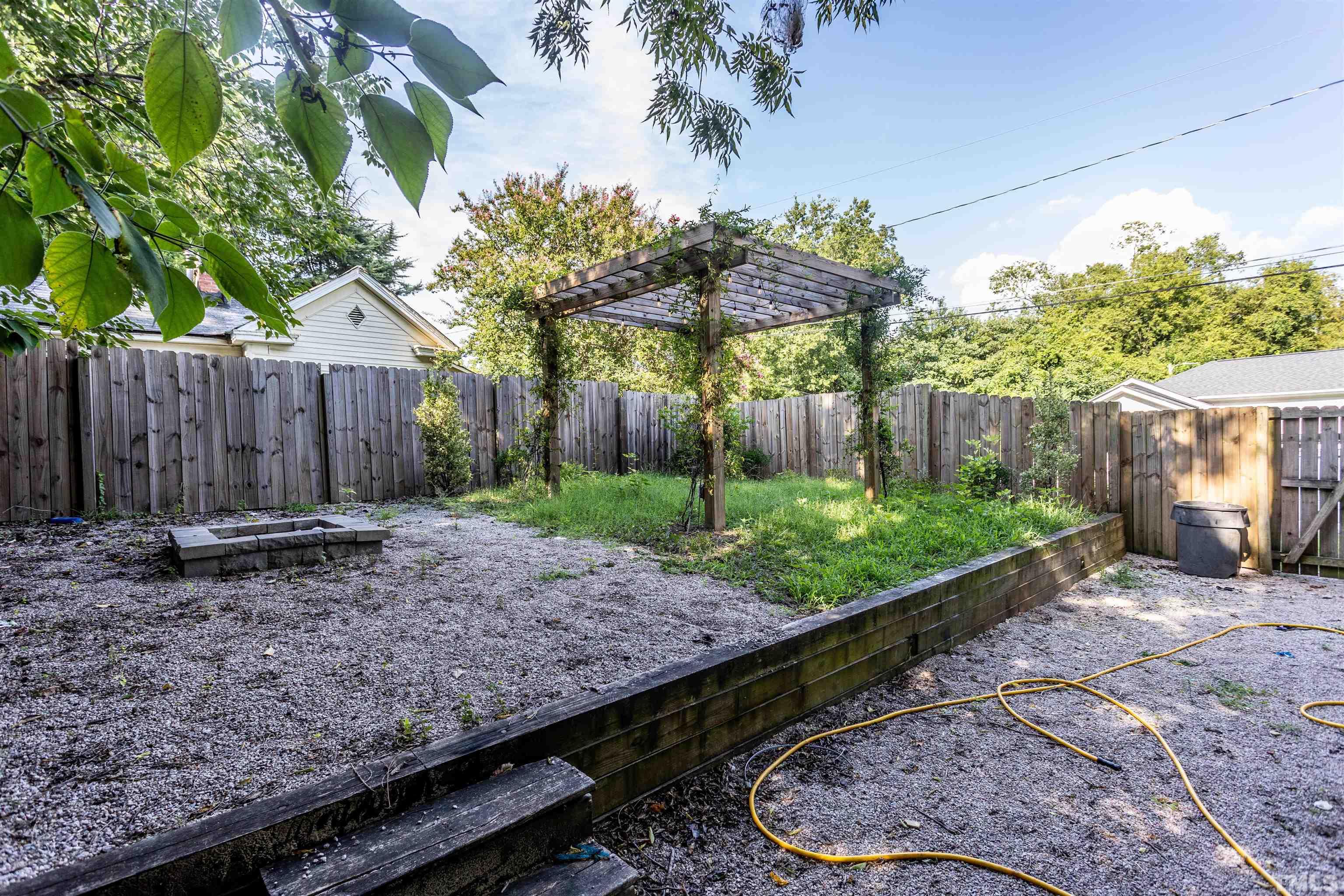 312 Freeman Street Raleigh, NC 27601 - Photo 24 of 30 a view of a backyard with wooden fence