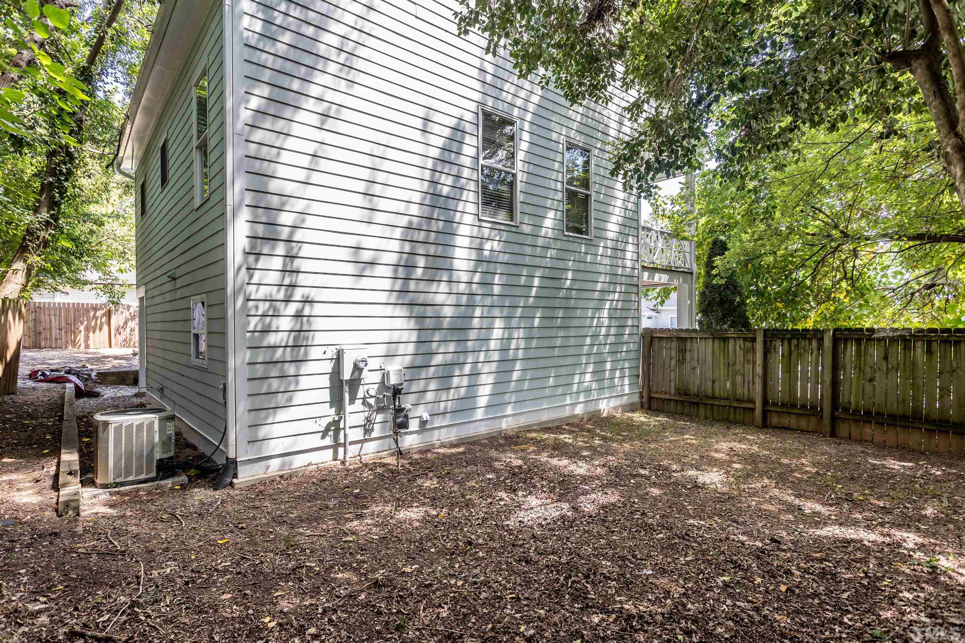 312 Freeman Street Raleigh, NC 27601 - Photo 29 of 30 a view of a house with a yard and wooden fence