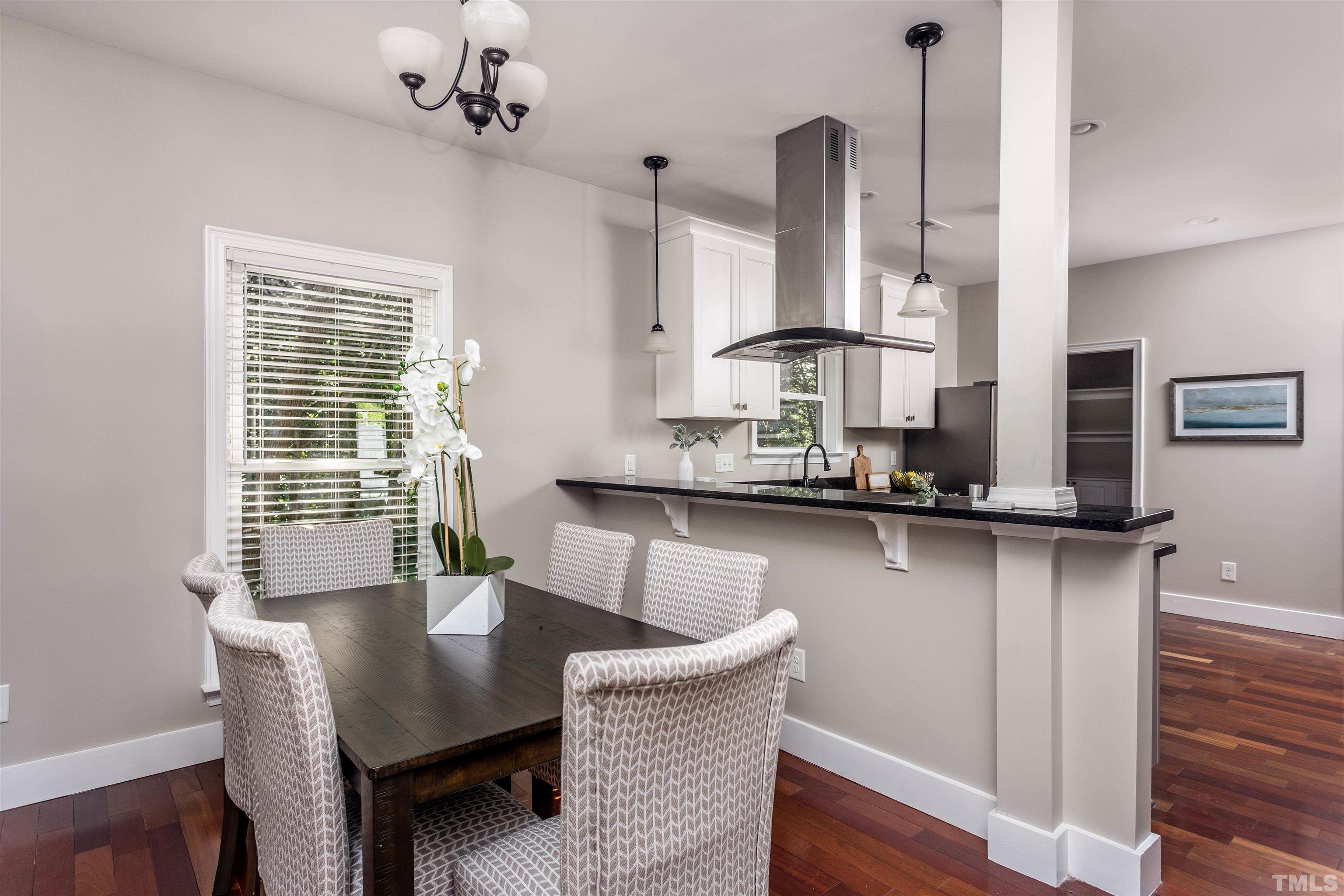 312 Freeman Street Raleigh, NC 27601 - Photo 8 of 30 a dining room with furniture and window