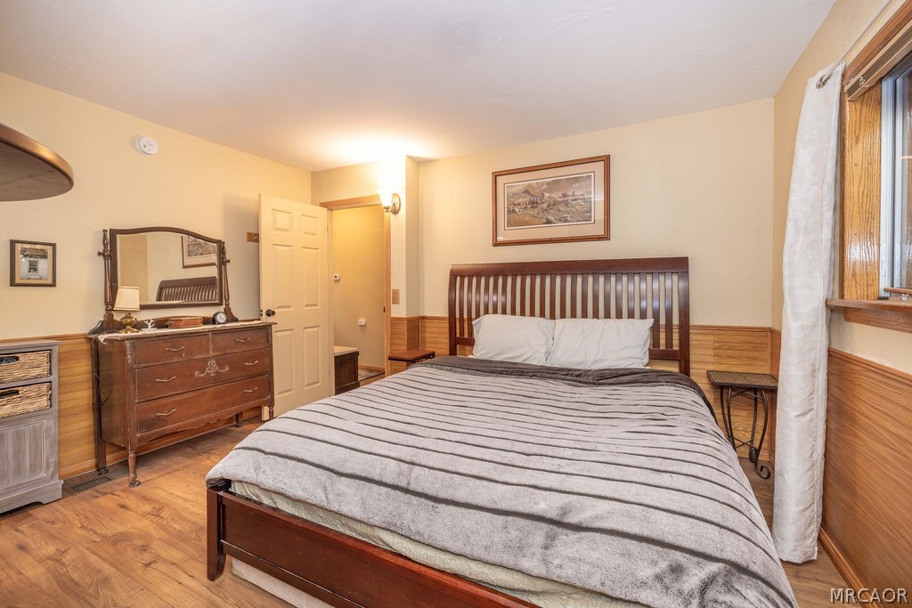 1179 Ridge Road Fawnskin, CA 92333 - Photo 36 of 43 a bedroom with a bed and a dresser