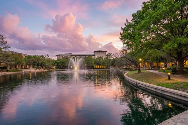 a lake view with boat and trees in the background