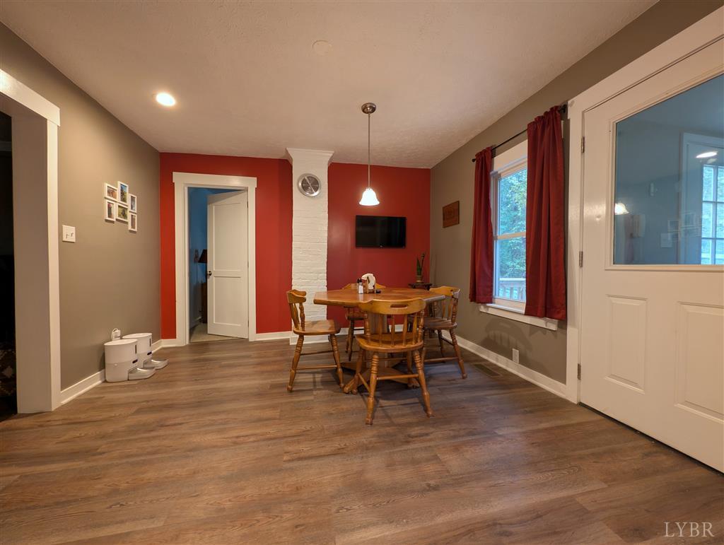 4470 Red Oak School Road Concord, VA 24538 - Photo 14 of 30 a view of a dining room with furniture and chandelier