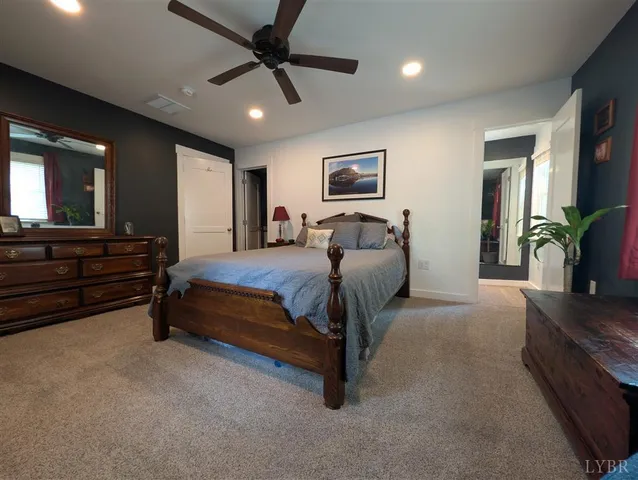 a living room with furniture ceiling fan and a rug