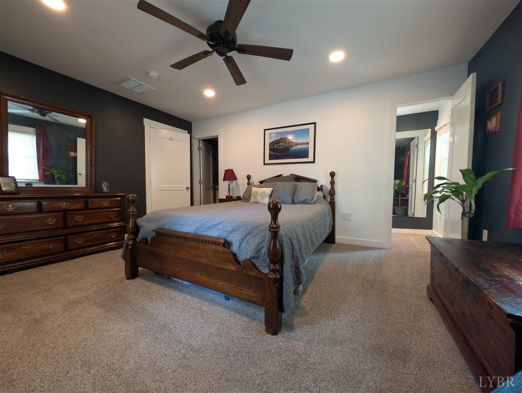 4470 Red Oak School Road Concord, VA 24538 - Photo 16 of 30 a living room with furniture ceiling fan and a rug