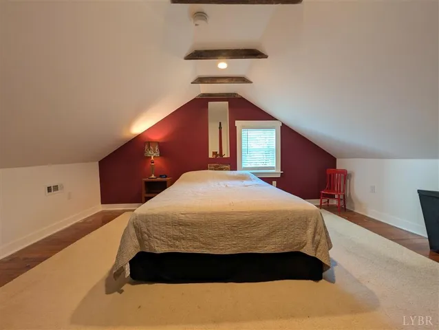 a bedroom with a bed and ceiling fan