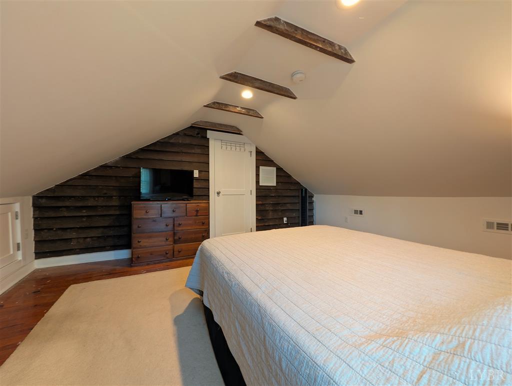 4470 Red Oak School Road Concord, VA 24538 - Photo 29 of 30 a bedroom with a bed and ceiling fan