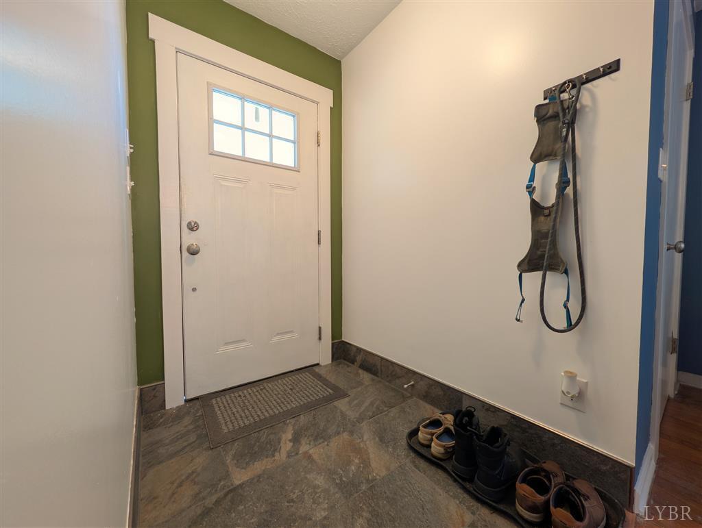 4470 Red Oak School Road Concord, VA 24538 - Photo 5 of 30 a bathroom with a granite countertop shower and a sink