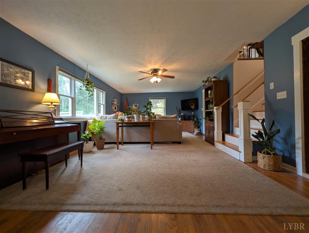 4470 Red Oak School Road Concord, VA 24538 - Photo 6 of 30 a living room with furniture and a piano