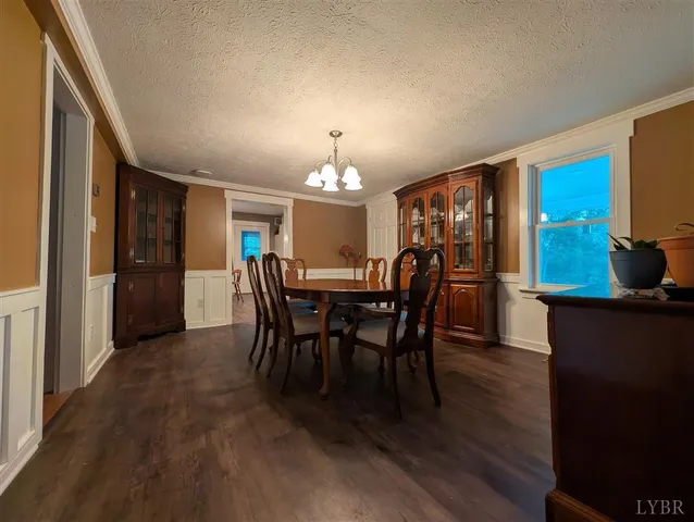 a view of a dining room with furniture and window