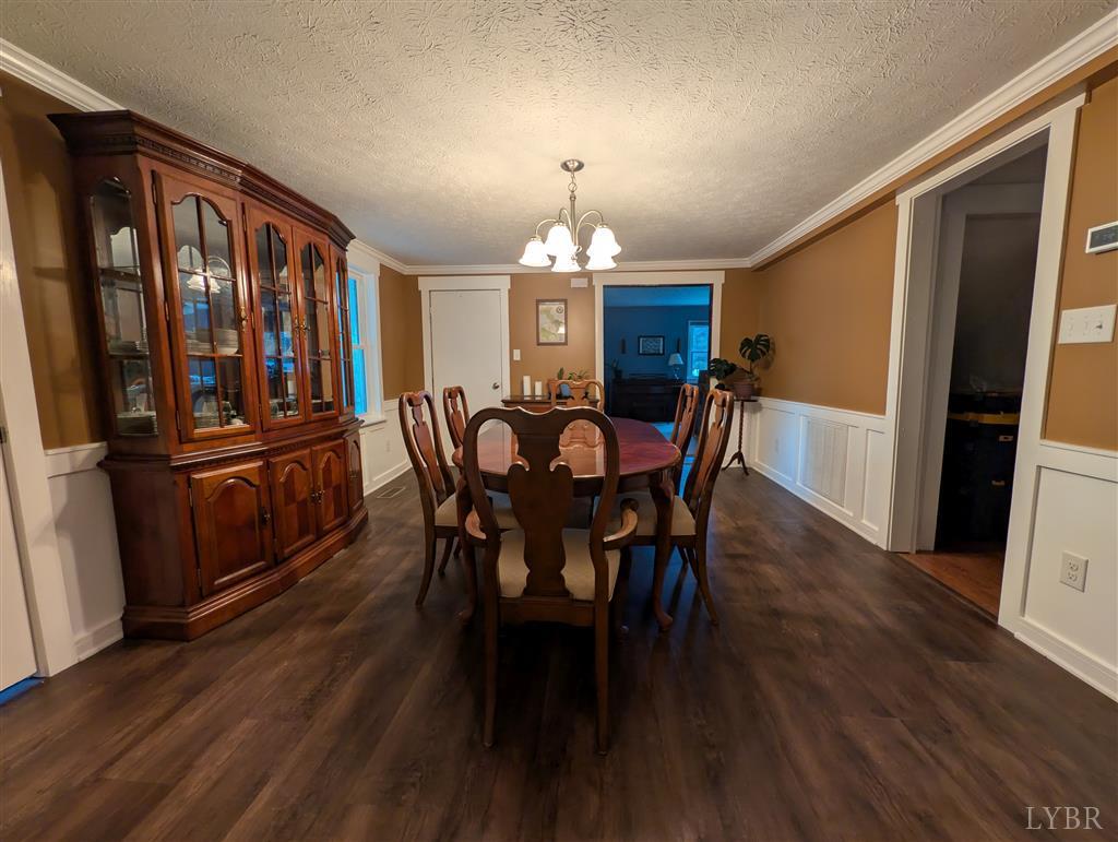 4470 Red Oak School Road Concord, VA 24538 - Photo 10 of 30 a view of a dining room with furniture window and wooden floor