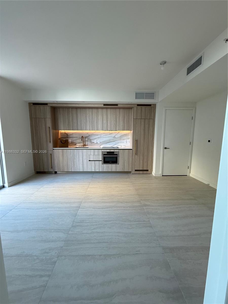 77 Southeast 5th Street, Unit 2015 Miami, FL 33131 - Photo 25 of 70 a view of kitchen and utility room